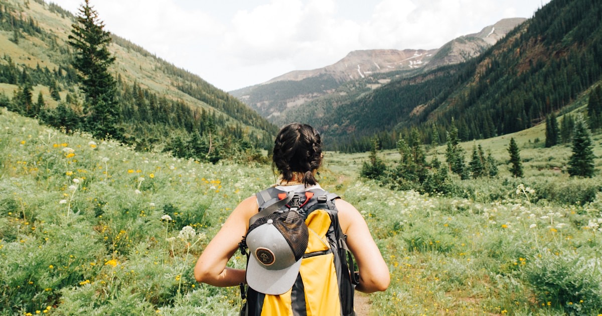 Person walking mindfully on a forest path