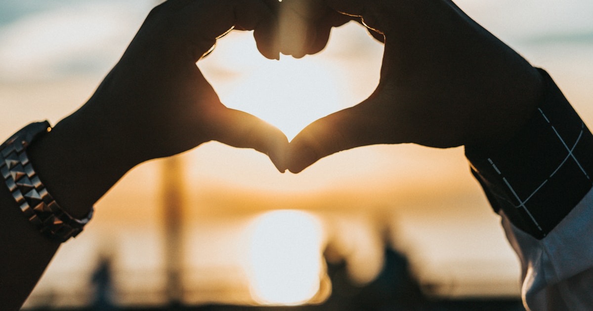 Two people sitting apart after argument, emotional distance visible
