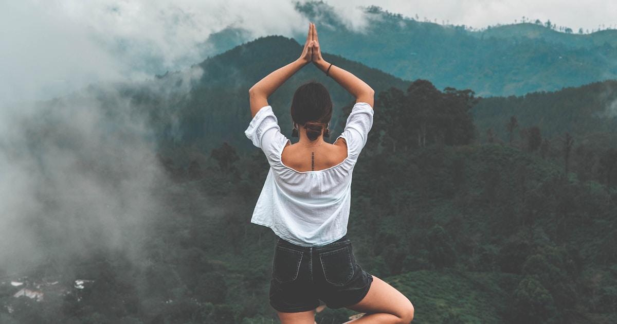 Beginner meditating peacefully with smartphone, morning light, calm and approachable AI meditation environment for first-time users