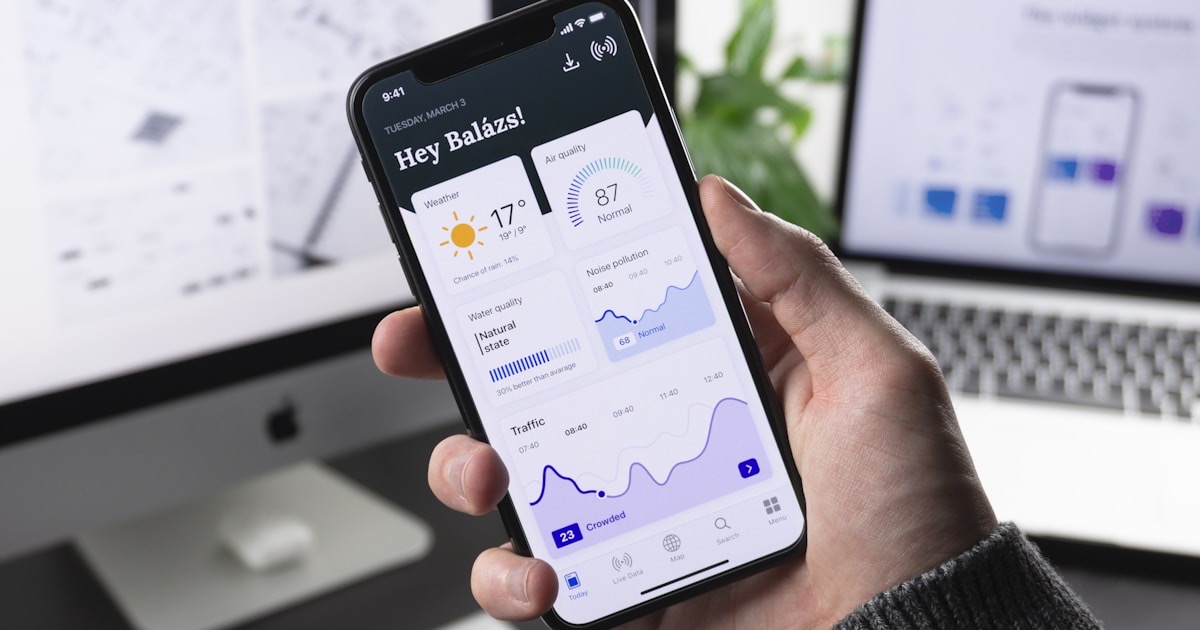 Woman comparing meditation apps on smartphone