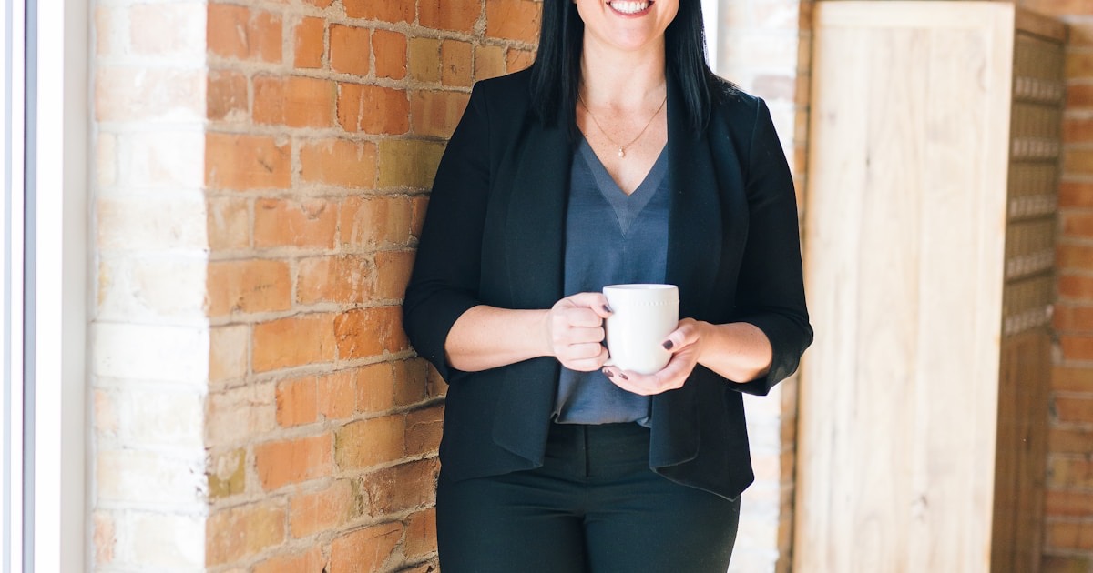 Person looking stressed and overwhelmed while working at computer desk with multiple browser tabs - workplace stress and meeting fatigue (inline)